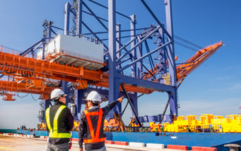 Foreman discuss about  during the new crane to deliverry by the vessel to berth for installation at the new port